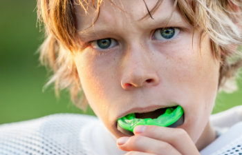 Boy putting in his mouth guard, Lawrenceville, GA